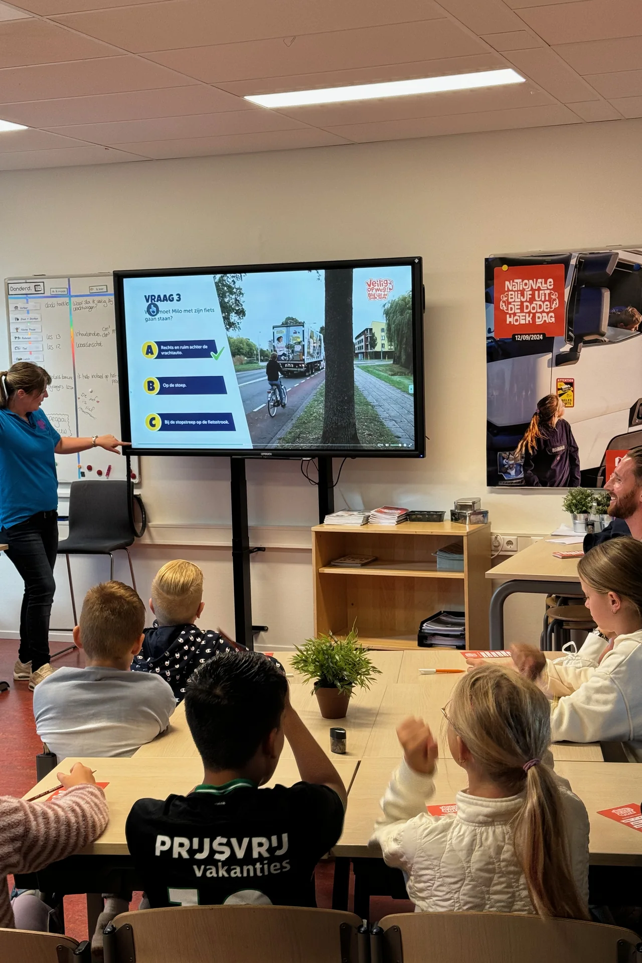 Pupils learn about safe behaviour around a truck in the classroom