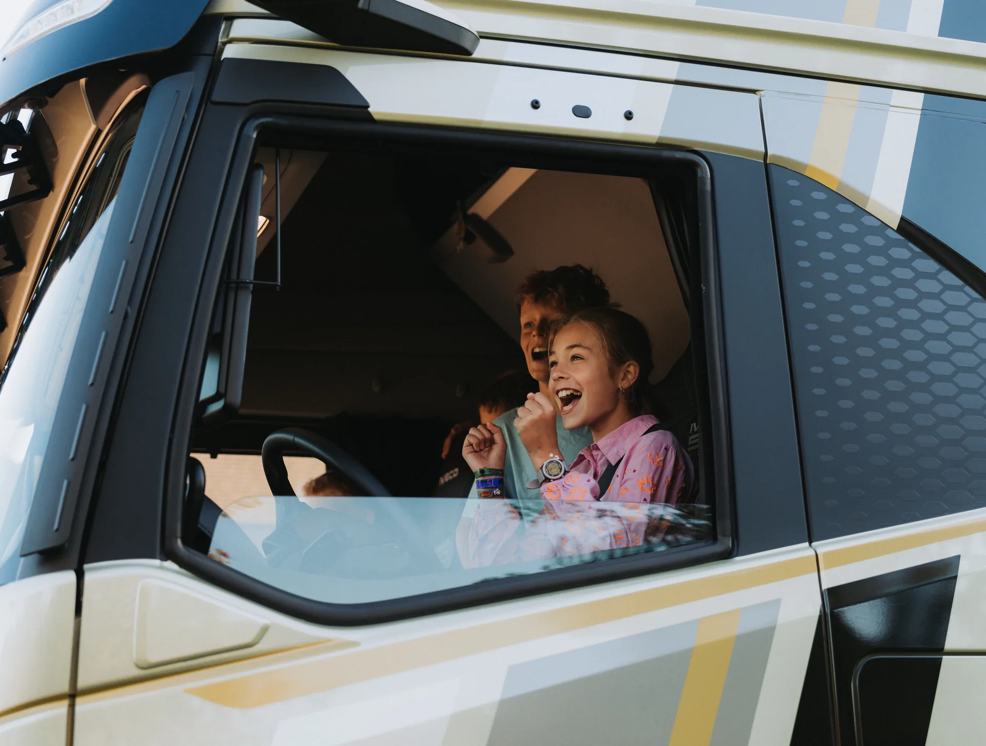 Smiling pupil in the truck cab during the 2025 National Stay Out of the Blind Spot Day